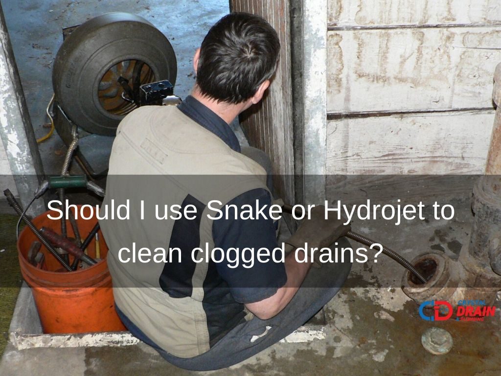 Should I use Snake or Hydrojet to clean clogged drains?